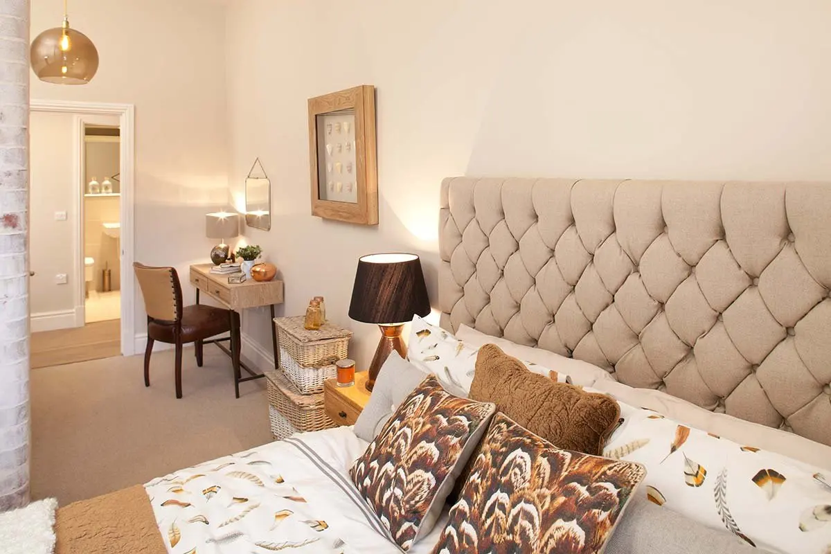 Bedroom with an upholstered headboard