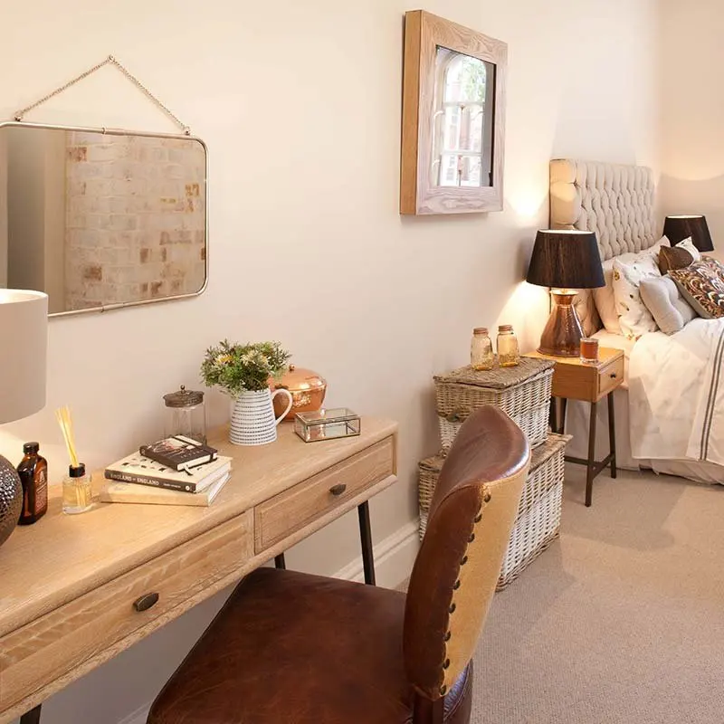 Dressing area with a desk and mirror