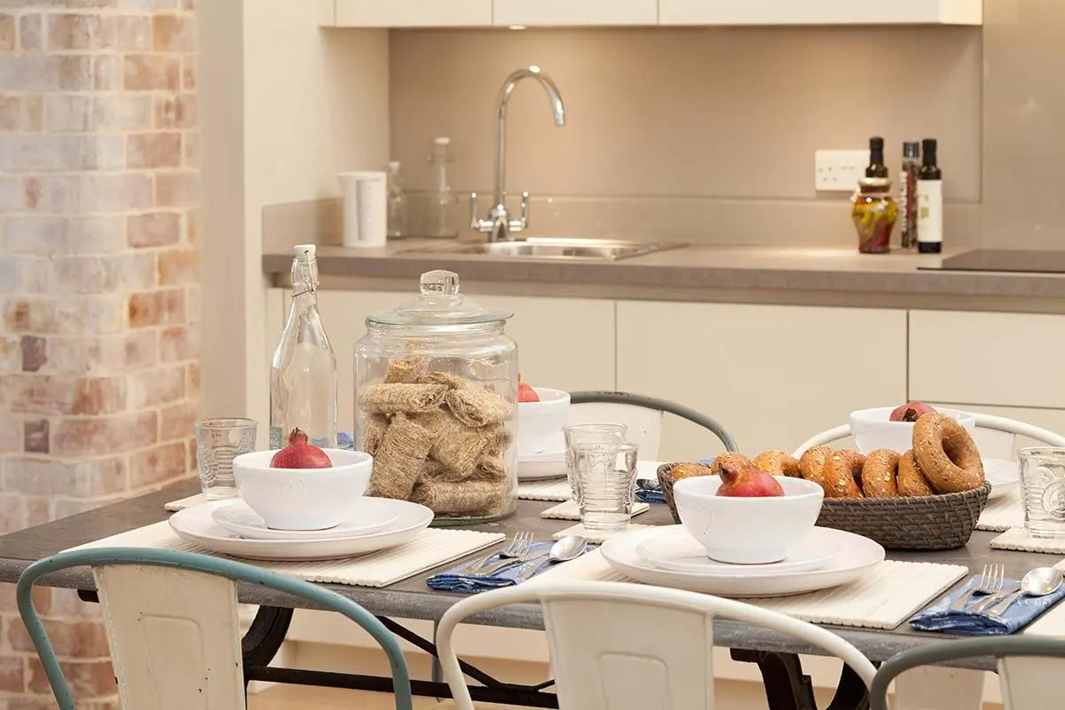 Kitchen and laid dining table