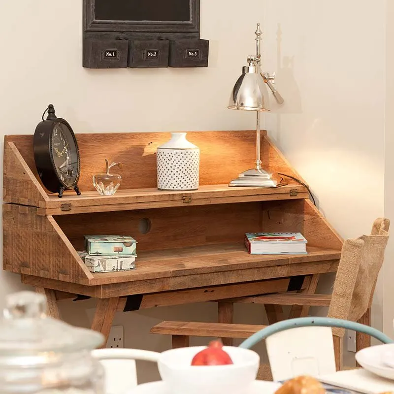 Antique writing desk with a lamp and books in a Bristol show apartment