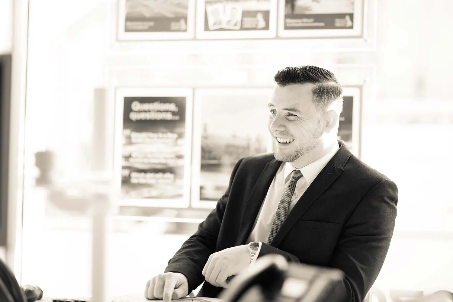 Black and white candid business portrait in an office