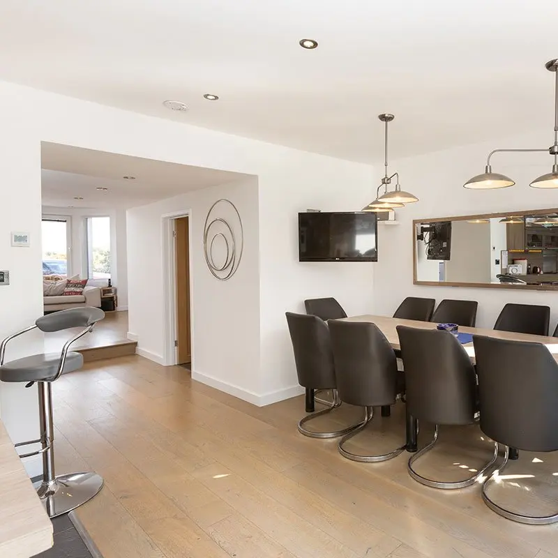 Dining table in front of the kitchen