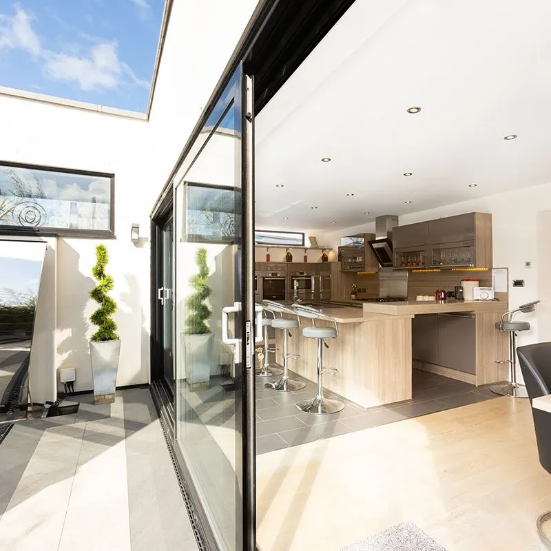 Kitchen opening onto a garden in Cheltenham