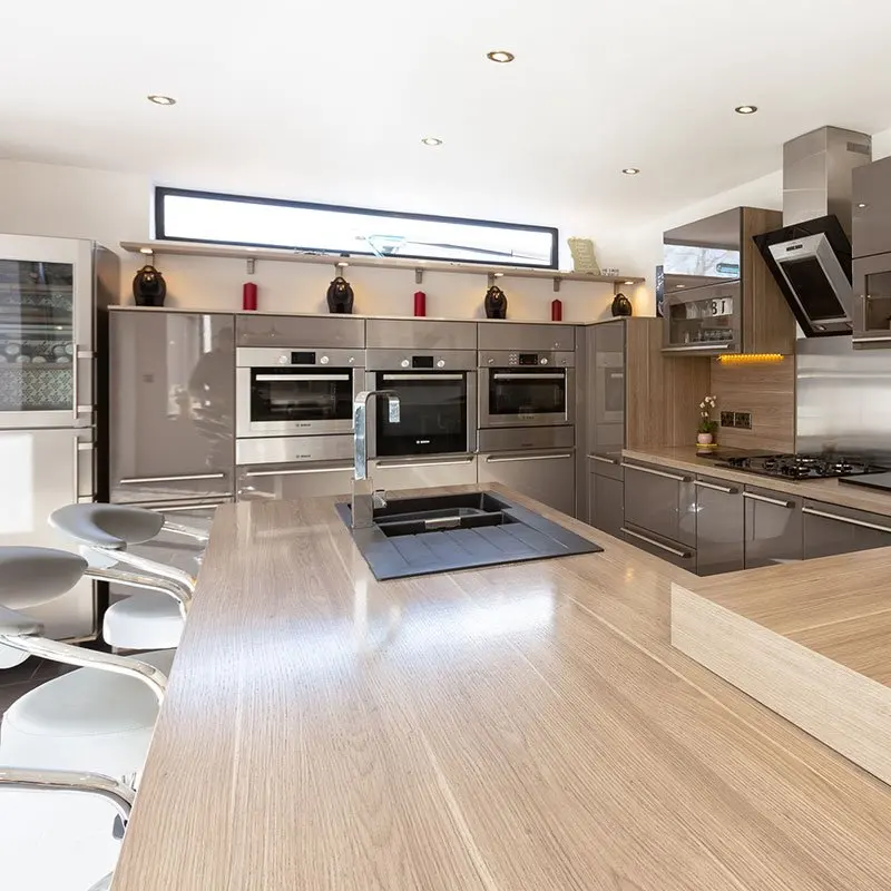 Kitchen with a breakfast bar and built-in ovens