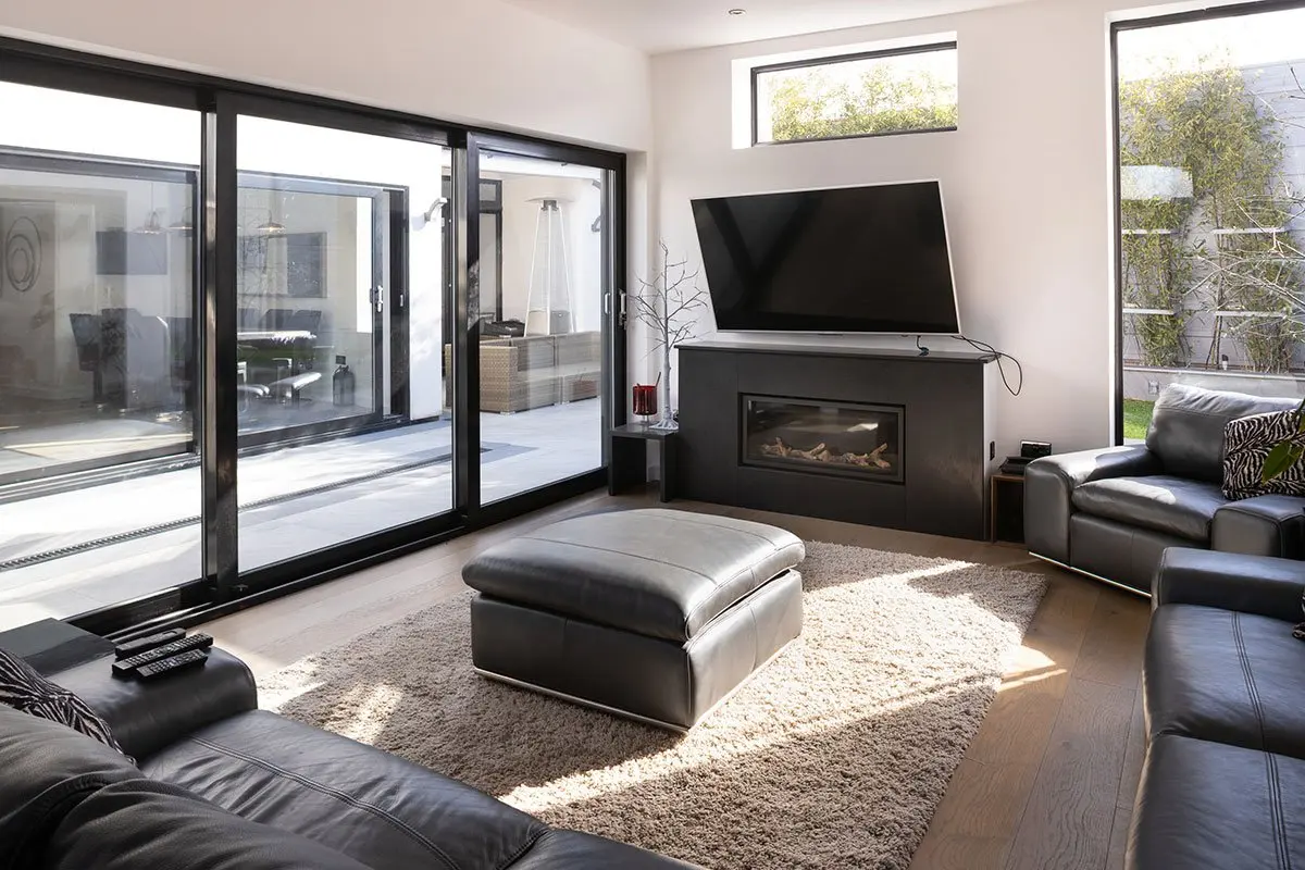 Open-plan living room with sliding glass doors onto the garden