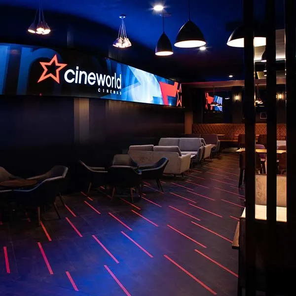 Cinema lounge with blue lighting and red floor lights