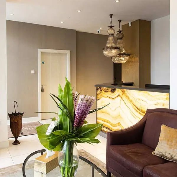 The new reception, with flowers and a lit marble counter