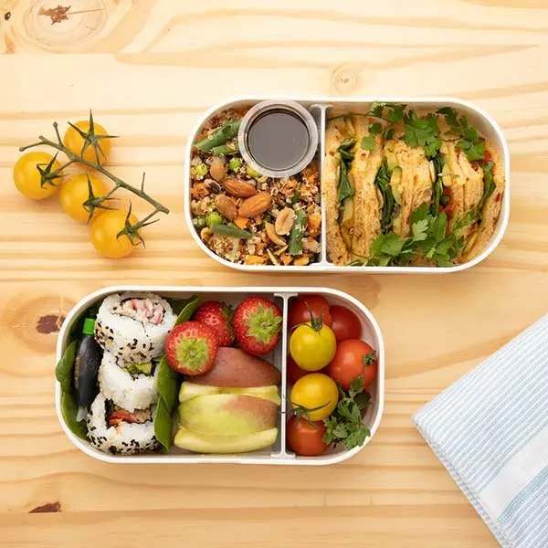 Bento lunch boxes filled with fresh food, from above