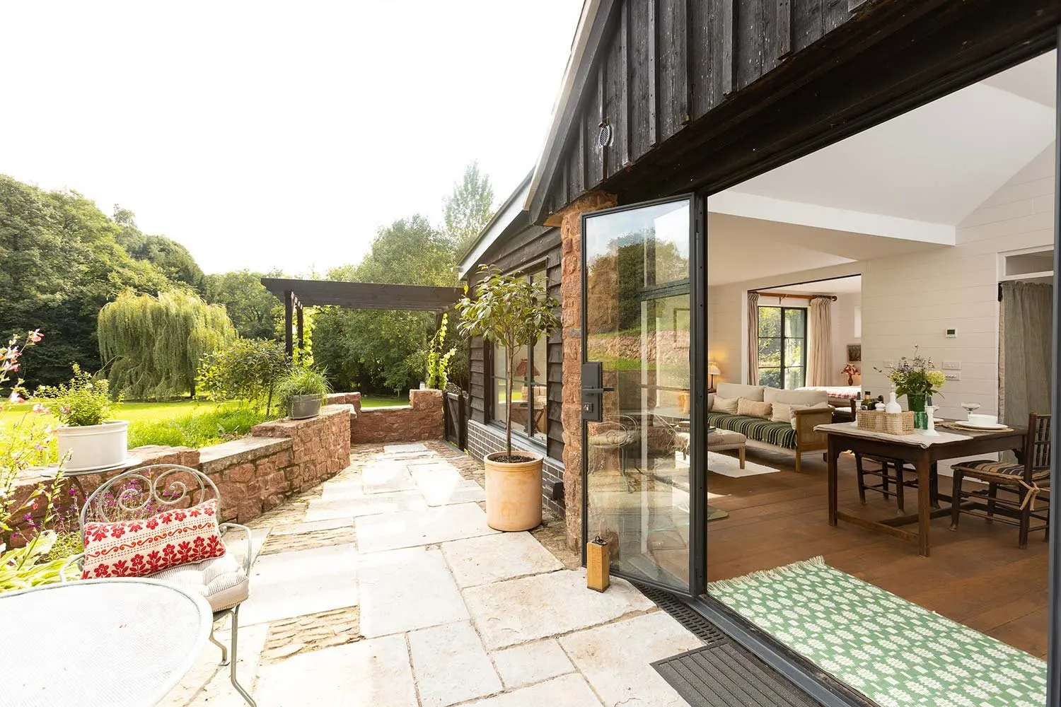 Patio and open doors into the cabin