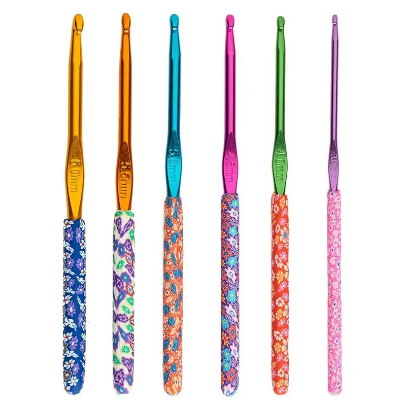 Patterned crochet hooks standing in a row