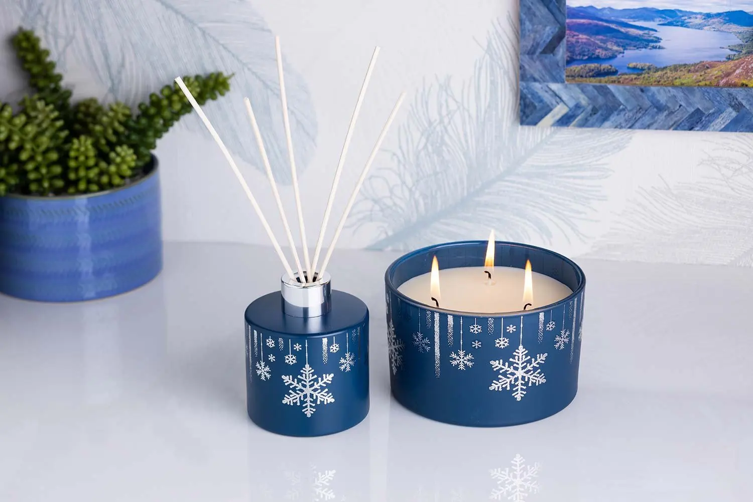 Reed diffuser and snowflake candle in navy