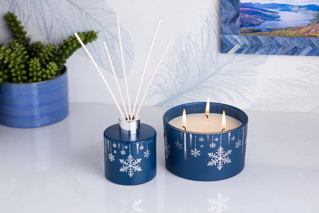 styled product photography reed diffuser and triple scented candle